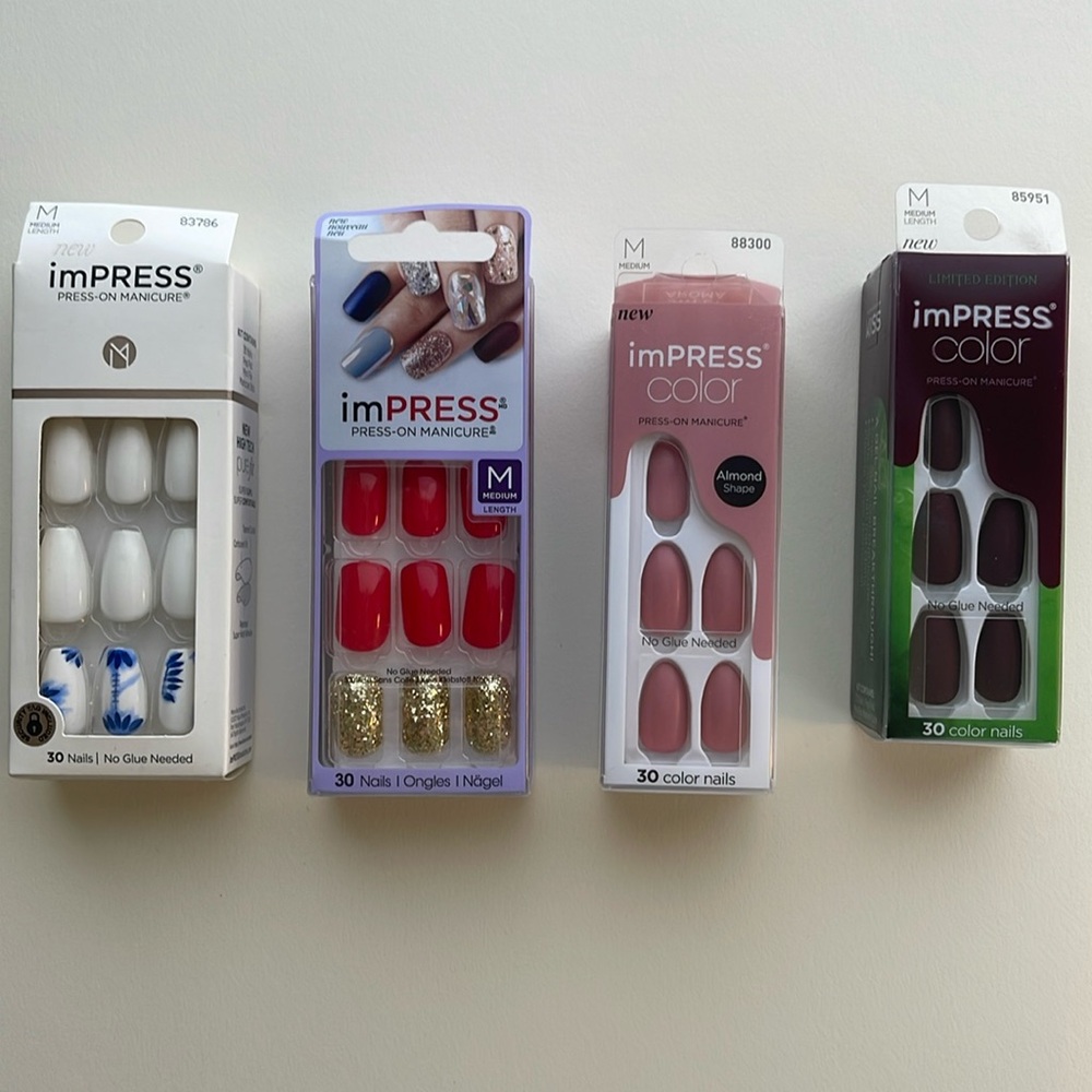 Lot of 4 unopened boxes of medium length nails.